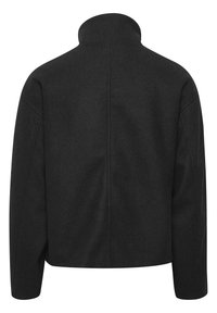 Veste en laine noire mélangée avec un col haut, des épaules tombantes et une silhouette carrée. Présente un design épuré et minimaliste sans matériel visible.