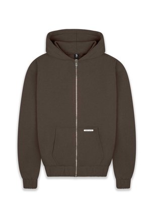 Braune Zip-Hoodie aus weichem Stoff, mit großer Kapuze, zwei Fronttaschen und gerippten Bündchen sowie Saum. Kleine Etikette an der Tasche.