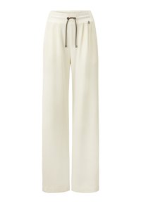 Pantalons larges en tissu crème, avec une taille élastique et un cordon de serrage marron, des poches sur les côtés et une texture lisse.