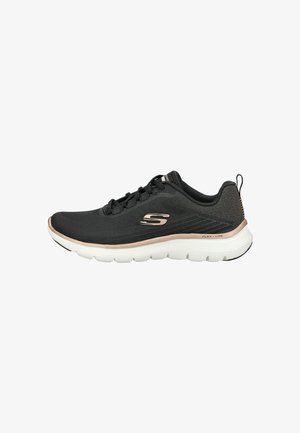 Black athletic shoe with mesh upper, round toe, and lightweight rubber outsole. Features a metallic bronze accent at the midsole.