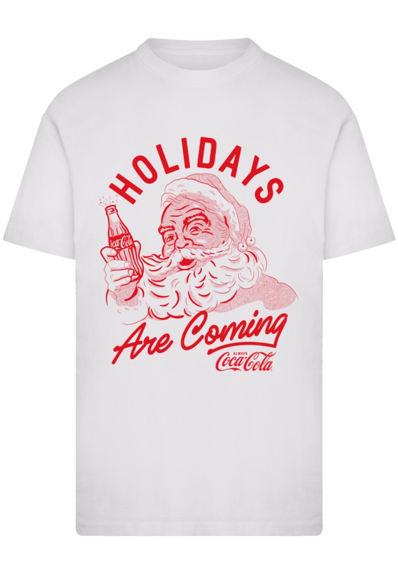 White cotton t-shirt featuring a red graphic of Santa holding a Coca-Cola bottle, with the text "HOLIDAYS Are Coming" above.