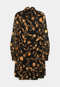 Svart klänning med långa ärmar som har ett intrikat gyllene blommönster, rund halsringning och ett knyt detaljer i ryggen. Mjuk tygstruktur.