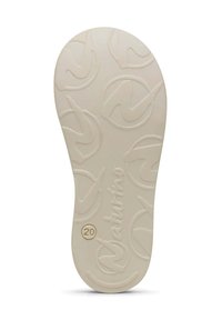 Suola di una scarpa in beige chiaro con un design a rilievo che presenta loghi arrotondati e il testo "Valentino" e "20". Texture liscia.