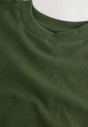 Sweatshirt en coton à col rond de couleur vert foncé, avec un col en ribbed et une texture lisse, offrant une coupe légèrement décontractée.