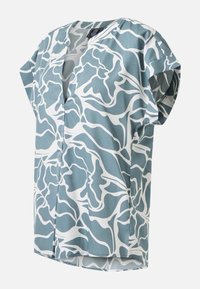 Blouse à manches courtes avec imprimé floral abstrait bleu et blanc, col en V et coupe ample et décontractée.