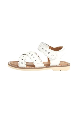 Sandalia blanca para niños con dos tiras perforadas con diseño de flores, una tira para el tobillo con velcro y una plantilla acolchada color canela.