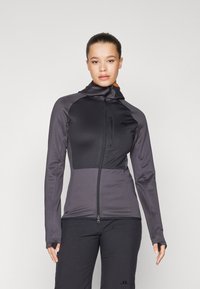 Dark gray athletic jacket with a fitted design, high collar, zip front, thumbholes, and contrast orange accents. Textured fabric.