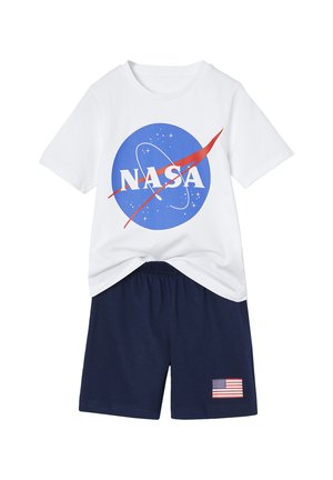 White short-sleeve t-shirt with blue NASA logo and navy blue shorts featuring a small American flag patch on the left leg.