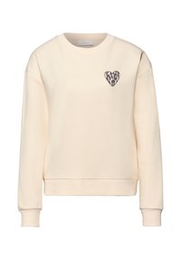 Sweatshirt couleur crème à col rond avec manches longues et petit cœur imprimé léopard sur la poitrine gauche.