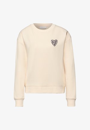 Felpa girocollo color crema con maniche lunghe e un piccolo cuore con stampa leopardata sul petto a sinistra.