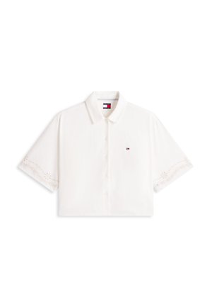 Cămașă albă cu mâneci scurte, cu nasturi și guler, margini fine brodate la mâneci și un mic logo Tommy Hilfiger pe piept.
