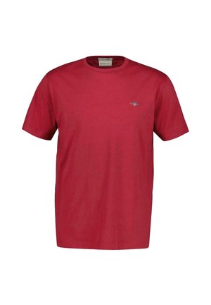 Maglietta rossa a maniche corte con scollo rotondo, piccolo logo ricamato sul petto a sinistra e etichetta del marchio GANT all'interno del colletto.