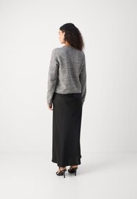 Lindex LUMI - Adīta jaka - black