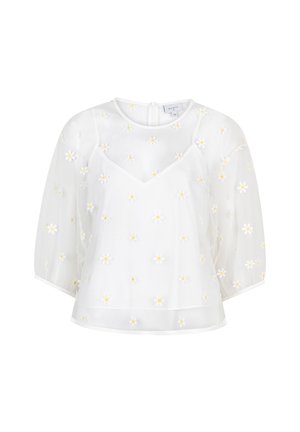 Witte blouse met korte, opgeblazen mouwen, een V-hals en fijne gele margrietborduursels overal. Lichtgewicht, vloeiend stof.