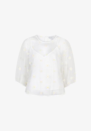 Witte blouse met korte, opgeblazen mouwen, een V-hals en fijne gele margrietborduursels overal. Lichtgewicht, vloeiend stof.