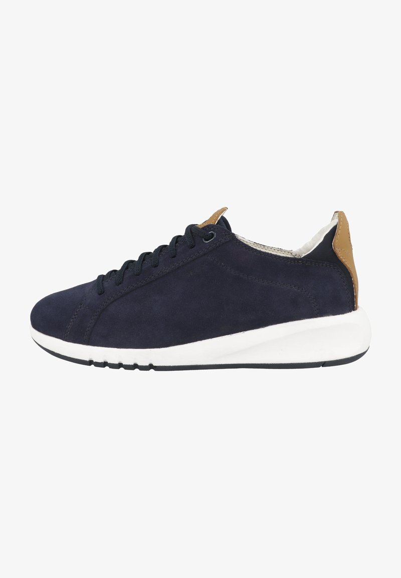 Navy suede low-top sneaker with black laces, white midsole, and brown leather accents at the heel. Smooth texture and round toe design.