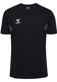 Svart T-shirt i bomull med V-hals och subtila grå detaljer på axlarna. Hummel-logotypen visas på framsidan.