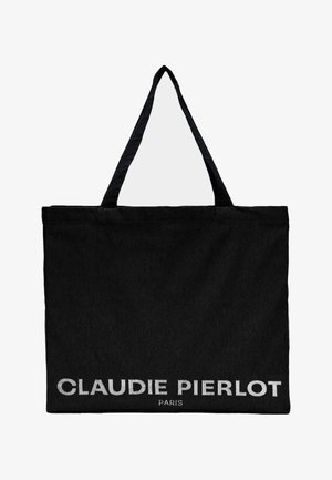 Bolso tote de tela negra con dos asas. En el frente presenta el texto "CLAUDIE PIERLOT PARIS" en letras blancas y negritas. Diseño simple.