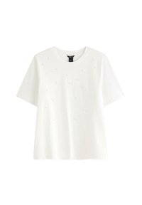Hvid bomulds t-shirt med korte ærmer, rund udskæring og dekorative små perle-lignende accenter jævnt placeret på fronten.