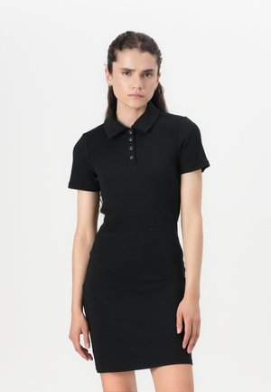 Black polo dress made of ribbed fabric, featuring a collar and five button placket. Short sleeves and a fitted silhouette.