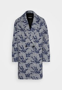 Double-breasted marineblauw en grijs herringbone wollen mantel met abstract bloemmotief en brede revers, middellange design.