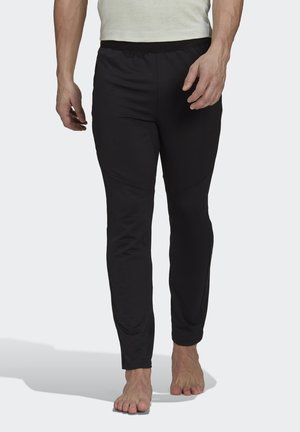 YOGA - Tracksuit bottoms - black