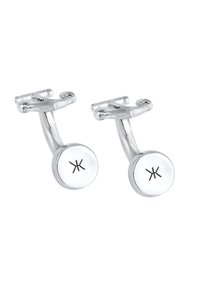Silverfärgade manschettknappar med en polerad yta, i rund form och med en minimalistisk design. Varje knapp har en symbol graverad på ytan.
