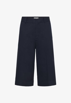 Tengerészkék, széles szárú, rövidített nadrág övbújtatókkal és rejtett elülső záródással, sima anyagból készült.