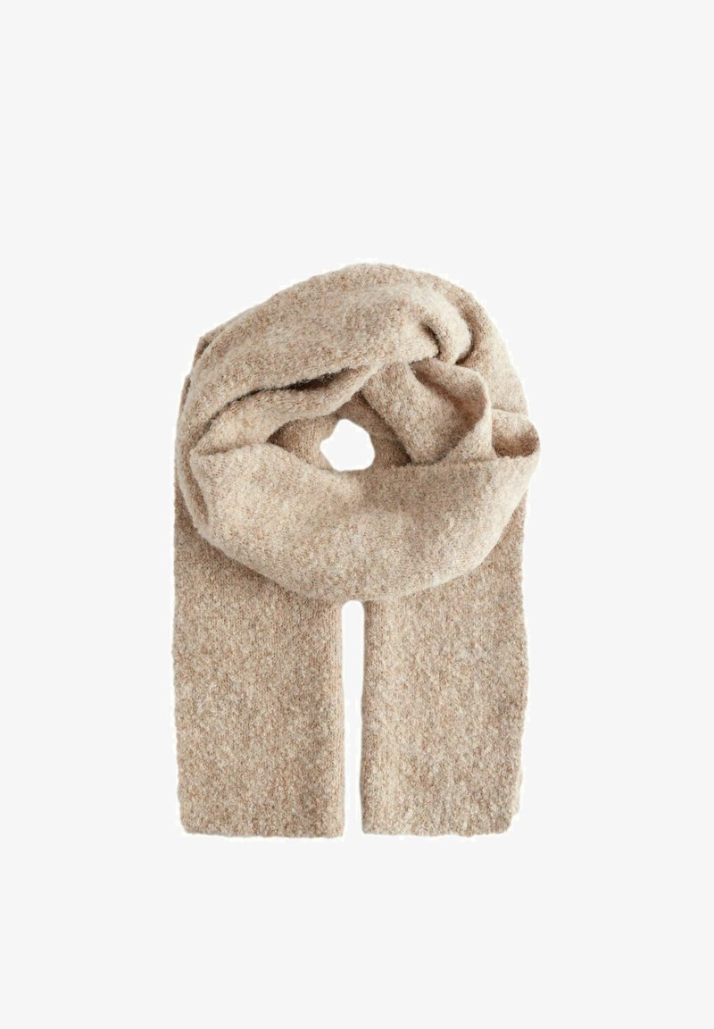Beige strukturierter Schal aus einem weichen, warmen Material, mit einem geknoteten Design und zwei langen Enden, die herabhängen.