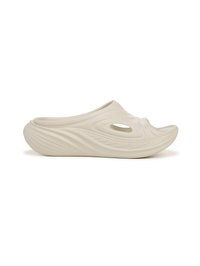 Light beige slip-on clog with a textured wavy surface, oval ventilation hole, and a curved, contoured shape for comfort.