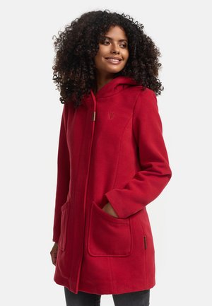 Red hooded coat in soft fabric, featuring large front pockets, a zip closure, and a subtle embossed logo on the left side.