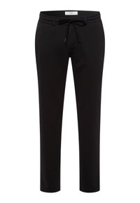 Zwarte sportbroek met een elastische tailleband, trekkoorddetails, twee zijzakken en een taps toelopend ontwerp. Gladde stoftextuur.