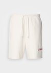 PREMIUM CHAIN - Tracksuit bottoms - tofu