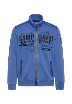 Blaue Reißverschlussjacke aus weichem Stoff, mit zwei Reißverschlusstaschen, gerippten Bündchen und bedruckten Grafiken auf der Front.