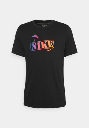 Black cotton t-shirt featuring a multicolored gradient "NIKE" logo with an umbrella icon above, round neckline, and short sleeves.