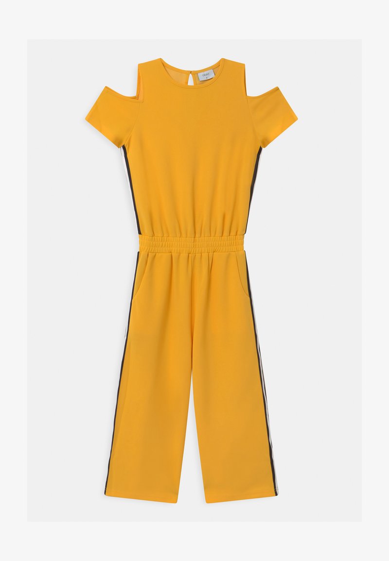 Macacão amarelo com design de ombros à mostra, mangas curtas, cintura elástica, bolsos laterais e painéis laterais pretos em contraste. Textura de tecido suave.