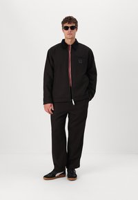 Carhartt WIP TRUMAN COAT - Light jacket - chocolate/black