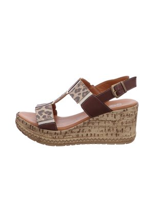 Keilsandale mit braunem Leder und Riemen im Leopardenmuster, Kork-Textur Plateausohle und verstellbarer Schnalle am Fersenriemen.