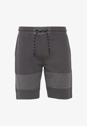 Sive hlače s elastičnim pasom na vrvico. Imajo gladko zgornjo teksturo in temnosive kontrastne panele v spodnjem delu.