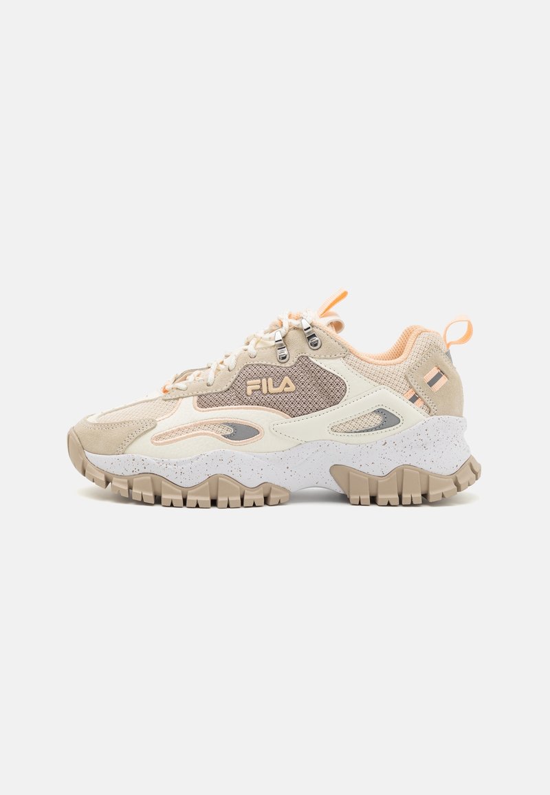 Beige and light orange athletic shoe with mesh and suede material. Features a speckled white midsole and textured rubber outsole. Fila logo displayed.