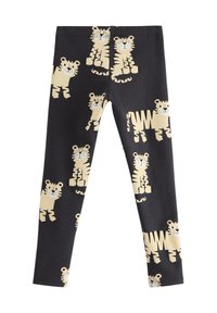 Svarta tights med ett upprepat mönster av bruna tecknade tigrar. Tillverkade av mjukt tyg med en slät yta och en figursydd design.
