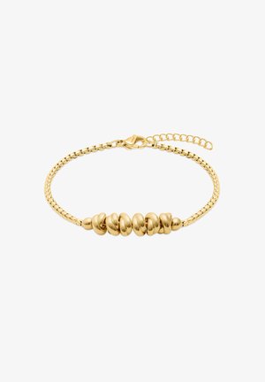 Bracelet chaîne en or avec des perles ovales torsadées polies au centre et fermoir lobster ajustable sur fond blanc.