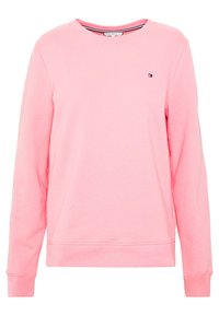 Helles rosa langärmliges Crewneck-Sweatshirt mit kleinem Tommy Hilfiger-Logo auf der linken Brust sowie gerippten Bündchen und Saum.