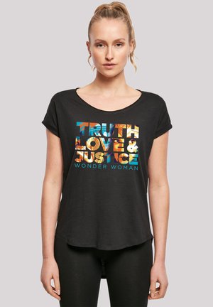 Black short-sleeve t-shirt featuring colorful text: "TRUTH LOVE & JUSTICE" with "WONDER WOMAN" below. Soft fabric, relaxed fit.