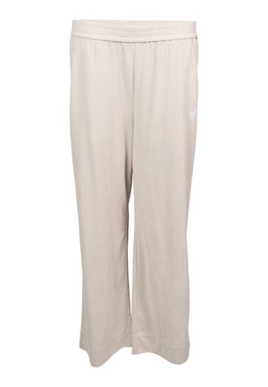 Pantalon large côtelé beige clair avec ceinture élastique et petit cœur blanc brodé sur la cuisse droite.