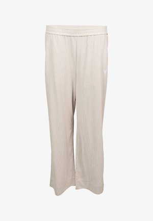 Pantalon large côtelé beige clair avec ceinture élastique et petit cœur blanc brodé sur la cuisse droite.