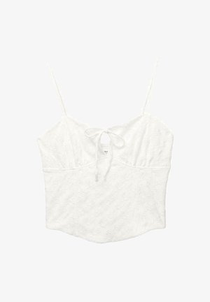Witte kant crop top met dunne bandjes en een klein strikdetail aan de voorkant van de halslijn.