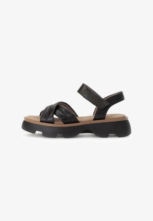 Zwarte leren sandalen met twee gekruiste banden, een verstelbare enkelband en een chunky, gestructureerde platformzool.