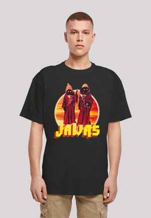 Black cotton t-shirt featuring a graphic of two robed figures with black eyes, set against a sunset with the text "JAWAS" in yellow.