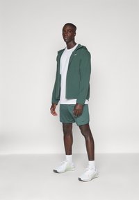 Nike Performance FORM - Training jacket - vintage green/reflective silver
